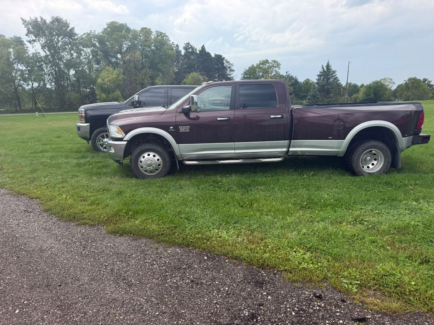 Maroon Ram 3500 HD in the yard